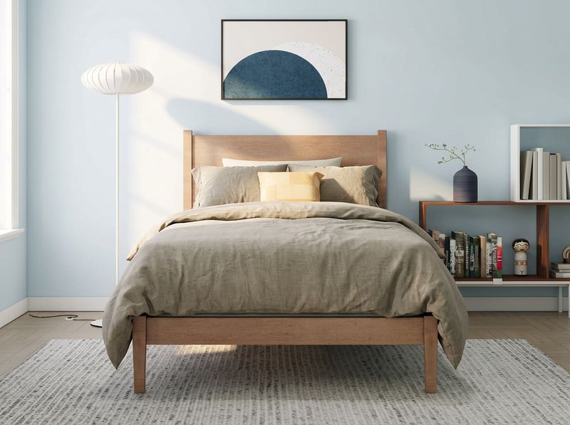 Side cross-section of hybrid mattress with airflow from foam surface through coil layer and out the sides